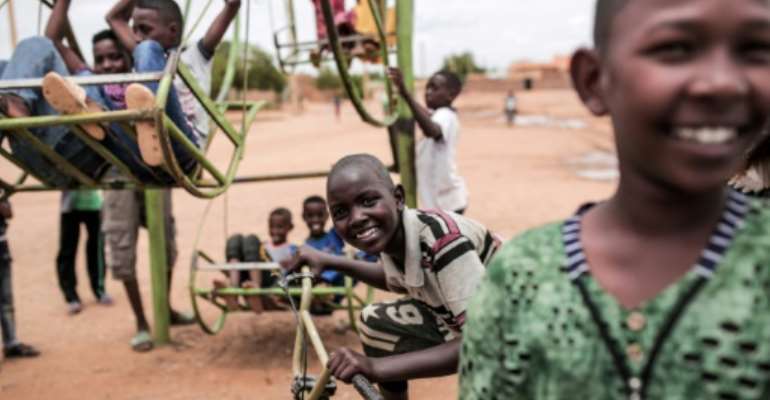 Sudanese children play in Omdurman, Khartoum’s twin city, in August 2019: a new schoolbook for teenagers reproducing Michelangelo's iconic