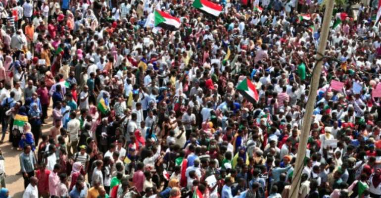 Sudanese citizens protested outside the presidential palace in Khartoum Thursday, in a bid to keep up the pressure on a transitional authority to ensure those responsible for killing demonstrators earlier this year are held to account. By Ebrahim HAMID (AFP)