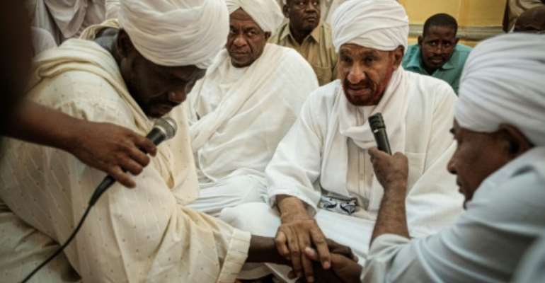 Sudanese opposition leader and former premier Sadiq al-Mahdi attends Friday prayers at a mosque linked to his National Umma Party in Khartoum's twin city of Omdurman on June 14, 2019. By Yasuyoshi CHIBA (AFP)