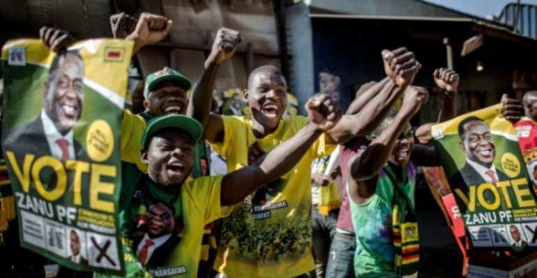 Supporters celebrated after Zimbabwe's President Emmerson Mnangagwa was declared the winner in the country's landmark election. By Luis TATO (AFP)