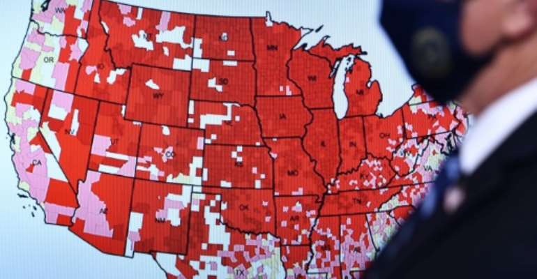 Surging virus cases in the US are forcing states to enforce new restrictions. By Brendan Smialowski (AFP)