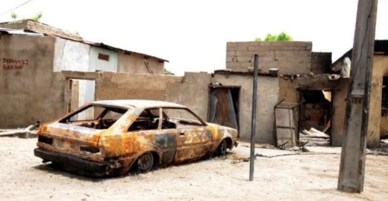 A house and car are ravaged by a bomb from the Islamist group Boko Haram in Maiduguri, Nigeria, on May 10, 2012. By Pius Utomi Ekpei (AFP/File)