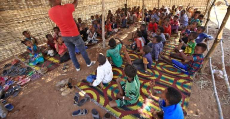 Teachers among the tens of thousands of Ethiopians who have streamed into neighbouring Sudan in recent weeks have set up schools for refugee children with help from the Norwegian Refugee Council. By ASHRAF SHAZLY (AFP)