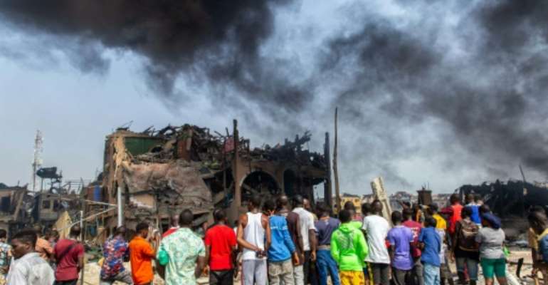 The blast destroyed buildings, lorries and cars.  By Benson IBEABUCHI (AFP/File)