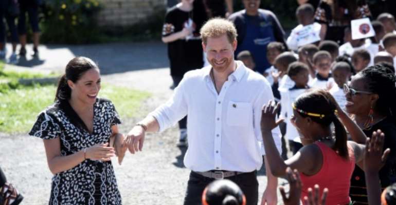 The Duke and Duchess of Sussex met members of the Justice Desk, a rights group in Cape Town's Nyanga township. By DAVID HARRISON (POOL/AFP)