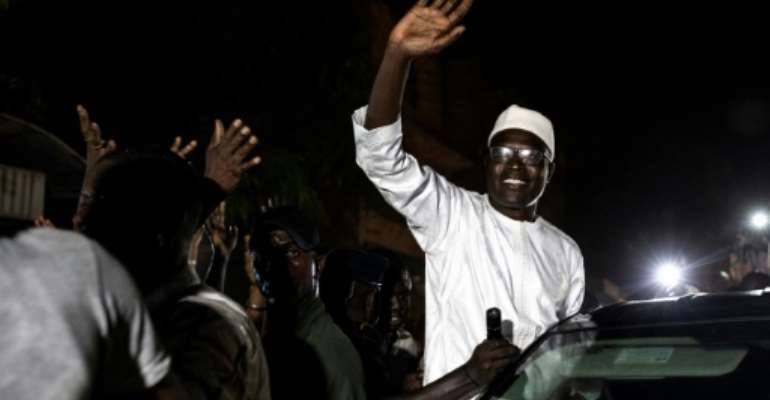 The former mayor at times emerged from of his car, raising his arms in a sign of victory. By JOHN WESSELS (AFP)