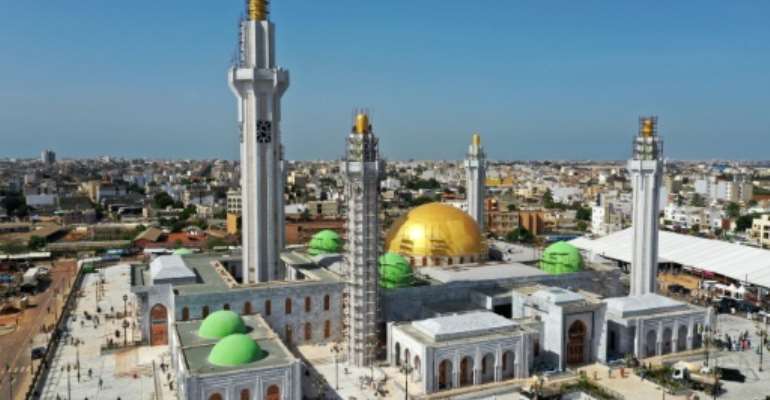 The huge Massalikul Mosque has risen from swampy land in the rundown district of Bopp. By Adrien BARBIER (AFP)