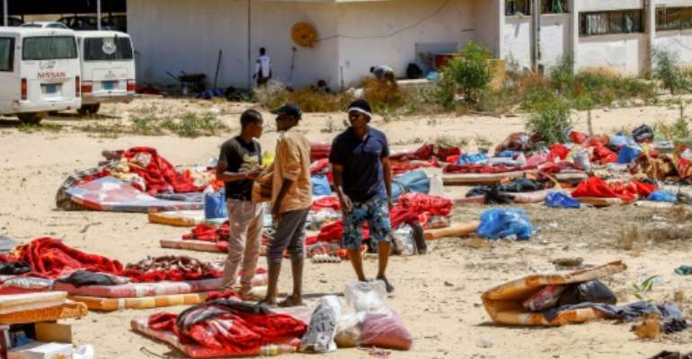 The International Organization for Migration says aound 300 migrants are still being held in a Libyan detention centre just days after aan air strike there killed 44 migrants. By Mahmud TURKIA (AFP)