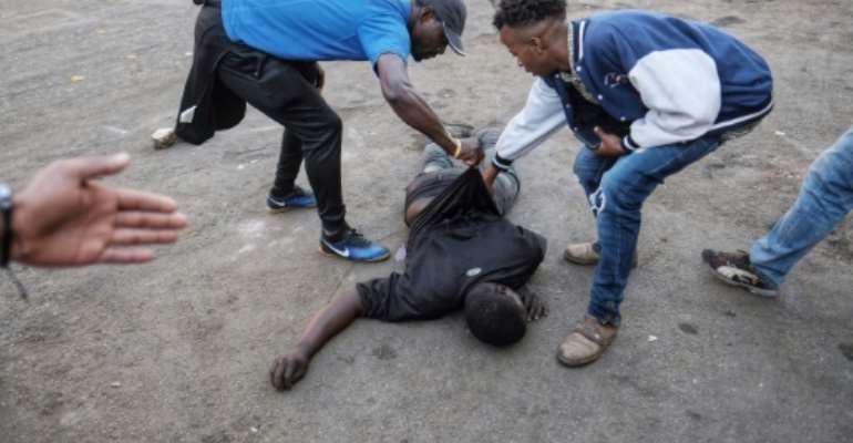 The man was fatally shot in the stomach during protests over alleged election fraud. By MARCO LONGARI (AFP)