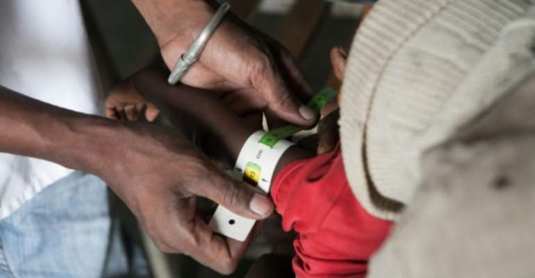 The population in drought-affected districts of Madagascar is almost entirely dependent on food aid, with the WFP handing out food parcels once a month. By RIJASOLO (AFP/File)