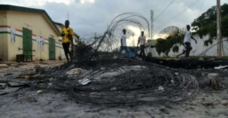 The scene in a Daoukro street last weekend after clashes between local youths from the Malinke and Baoule groups. By SIA KAMBOU (AFP)