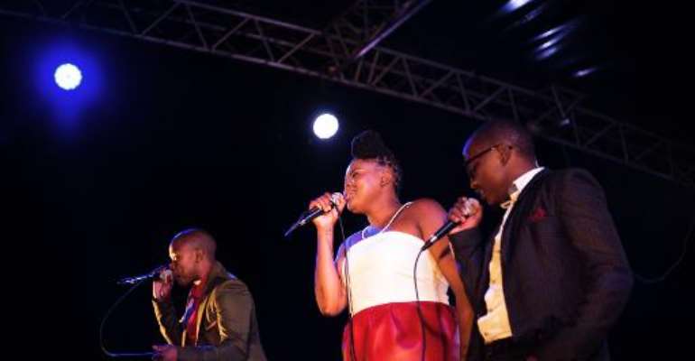 Members of the South African a capella group The Soil, Ntsika Ngxanga (R), Buhle Mda (C) and Phindo Ngxanga (L) perform in Johannesburg on February 15, 2014. By Marco Longari (AFP/File)