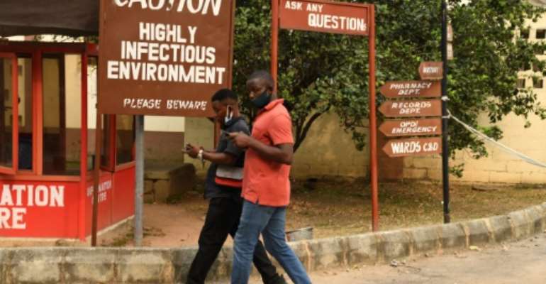 The Yaba Mainland Hospital is festooned with signs warning of the infection danger. By PIUS UTOMI EKPEI (AFP)