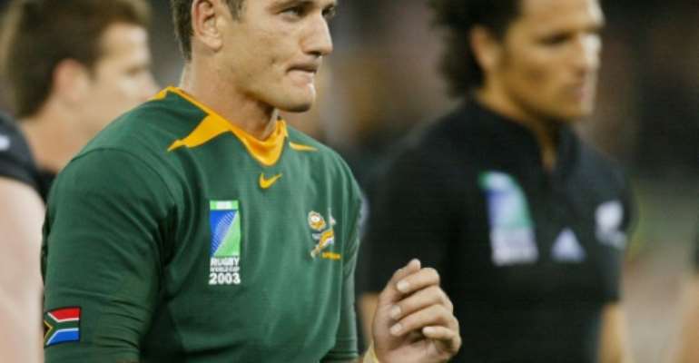 Then South Africa scrum-half Joost van der Westhuizen (L) leaves the field at the end of the Rugby World Cup quarter-final against New Zealand at the Telstra Dome Stadium in Melbourne on November 8, 2003. By William WEST (AFP/File)
