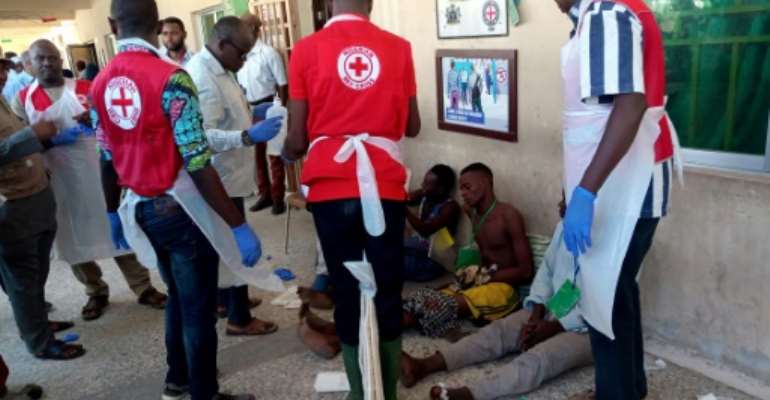 Three bombers detonated their explosives outside a hall in Konduga, 38 kilometres (24 miles) from the Borno state capital Maiduguri, where football fans were watching a match on TV on Sunday evening. By Audu Ali MARTE (AFP)