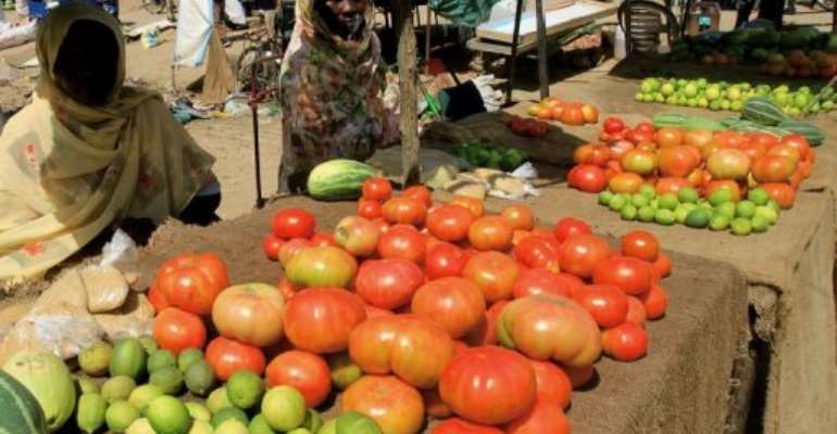 Sudanese women sell vegetables at the market of Omdurman. By Ashraf Shazly (AFP/File)