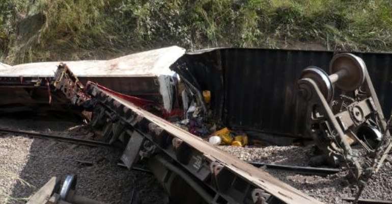 Derailed wagons after a train sped off the rails 65km north of Kamina, in the southern province of Katanga, Democratic Republic of Congo, on April 22, 2014. By Numbi Mathys (AFP/File)