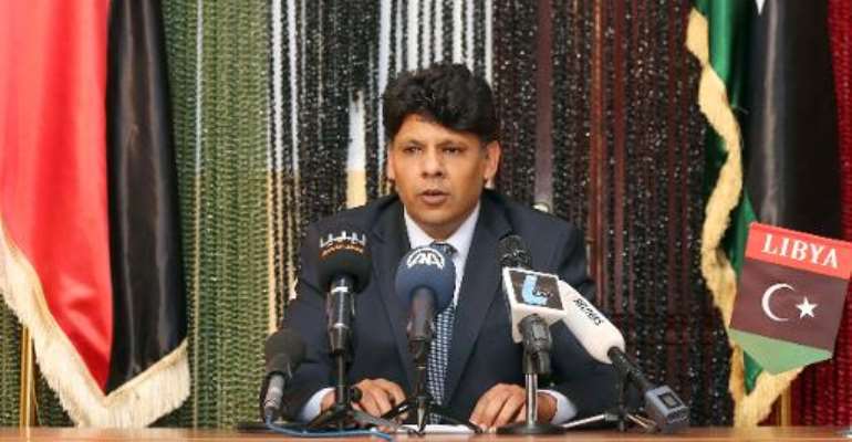 Seddik al-Sour, spokesman for the Libya state prosecutor's office, speaks during a press conference on March 24, 2014, in Tripoli. By Mahmud Turkia (AFP)