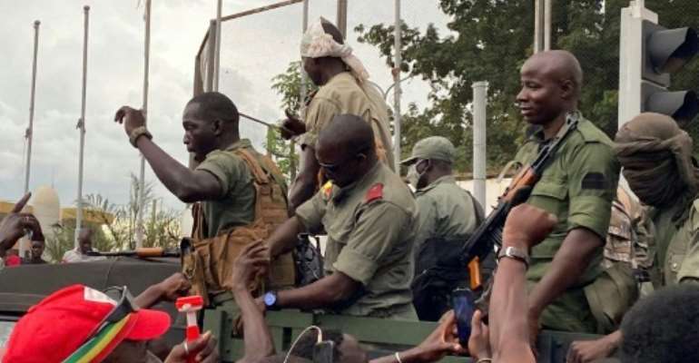 Troops were cheered by crowds as they arrived at Independence Square in Bamako. By STRINGER (AFP)