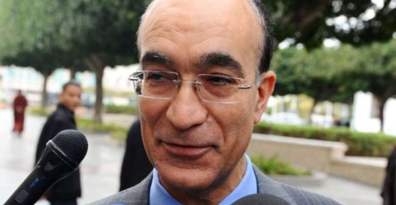 Ridha Grira speaks to the press upon arrival at the government palace in Tunis on January 20, 2011. By Fethi Belaid (AFP/File)