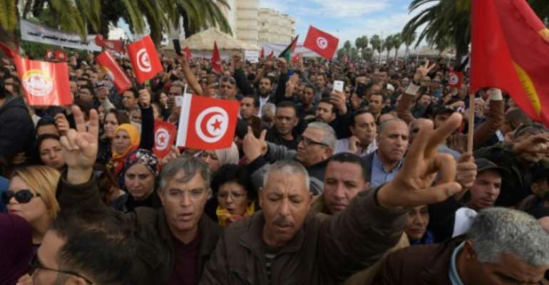 Tunisians protest in the capital Tunis during a general strike by civil servants on November 22, 2018. By FETHI BELAID (AFP)