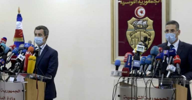 Tunisia's Interior Minister Taoufik Charfeddine (R) gives a joint press conference with his French counterpart Gerald Darmanin in the capital Tunis on Friday. By FETHI BELAID (AFP)