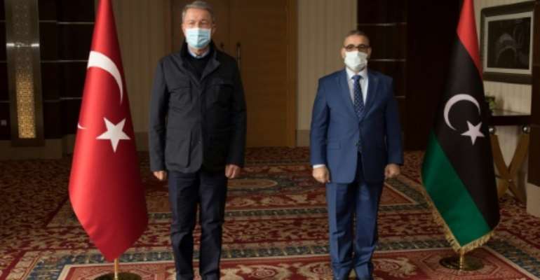 Turkey's Defence Hulusi Akar (L) made an unexpected visit to Libya where he met top officials including Khaled el-Mechri who heads the High State Council aligned with the Tripoli-based UN-recognised Government of National Accord. By - (AFP)