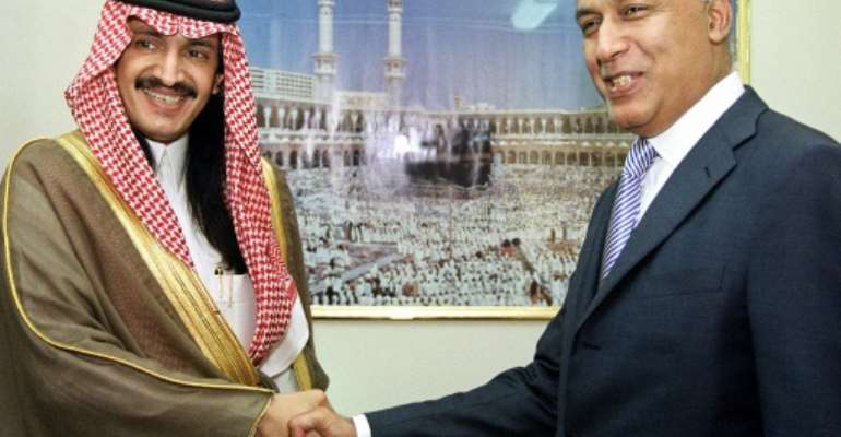 Turki bin Bandar bin Mohamed bin Abderrahmane al-Saud shakes hands with Pakistan's Finance Minister Shaukat Aziz in Islamabad in a file picture from 15 September 2003. By FAROOQ NAEEM (AFP)