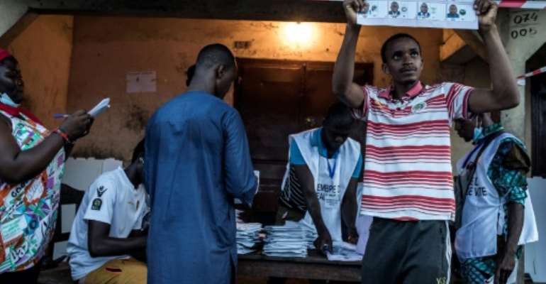 Twelve candidates are contesting the presidency, including the frontrunners Conde and Diallo. By JOHN WESSELS (AFP)