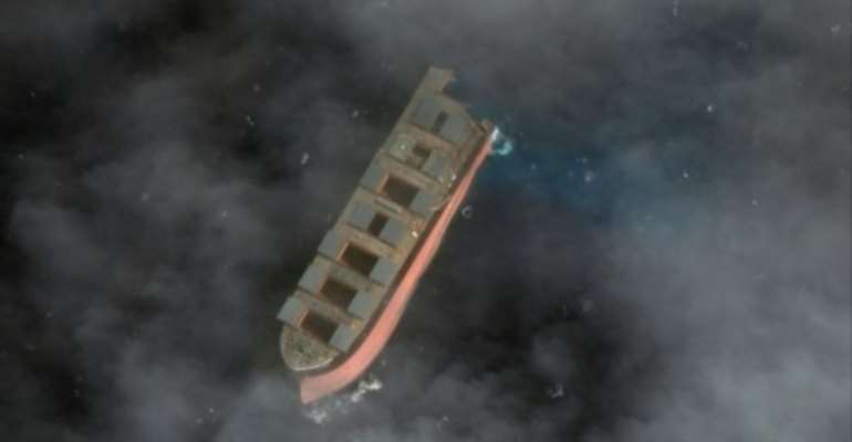 Two tugboats towed the larger part of the wreck some 15 kilometres (nine miles) out into the open ocean. By Handout (Satellite image ©2020 Maxar Technologies/AFP)