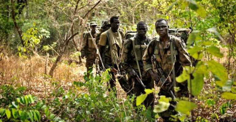 Ugandan soldiers patrol on April 18, 2012 through the Central African jungle during an operation to fish out notorious Lord's Resistance Army (LRA) leader Joseph Kony. By Yannick Tylle (AFP/File)