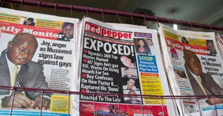 A newspaper stand in Kampala displays Uganda's local dailies on February 25, 2014, a day after the president signed a tough new anti-gay law. By Isaac Kasamani (AFP)