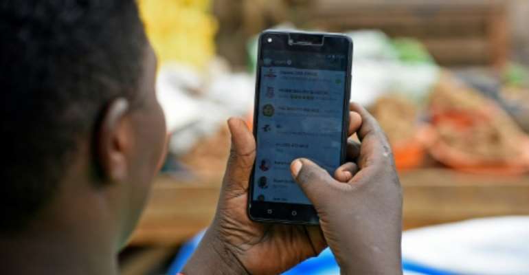 Uganda's tax on social media has run into angry opposition from users. By Isaac Kasamani (AFP)