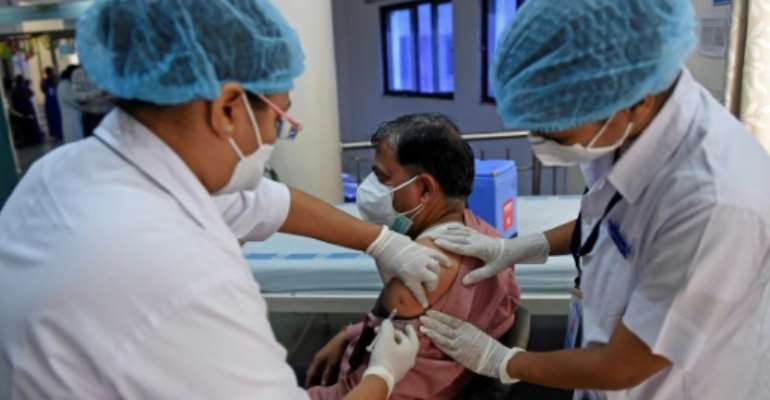 Until vaccines are fully rolled out, countries have few options but to rely on lockdown restrictions to curb the spread of the virus. By Sam PANTHAKY (AFP/File)