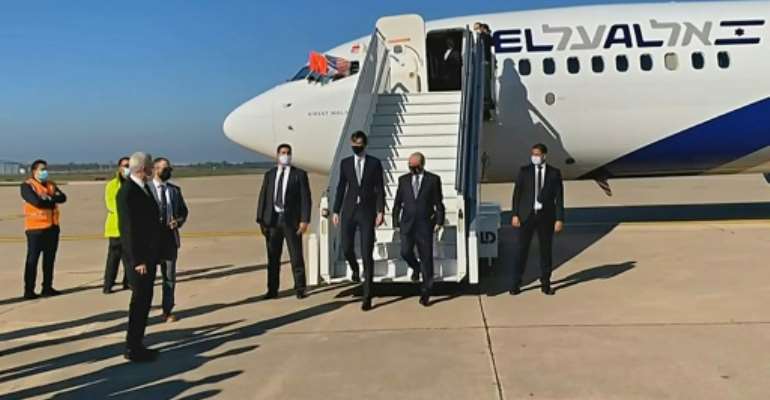 US President Donald Trump's son-in-law and advisor Jared Kushner (L) and Israeli National Security Advisor Meir Ben Shabbat leave the plane in Rabat. By - (US EMBASSY IN MOROCCO/AFP)