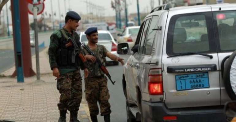 Yemeni soldiers control vehicles near Sanaa International Airport on August 6, 2013 in Yemen. By Mohammed Huwais (AFP)