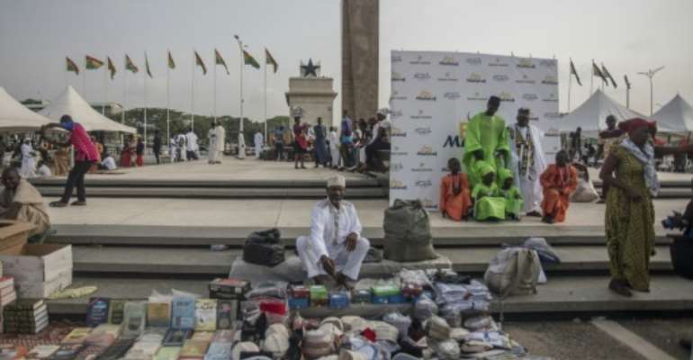 Vendors selling merchandise in Accra's Independence Square, part of the waterfront area earmarked for development. By CRISTINA ALDEHUELA (AFP)
