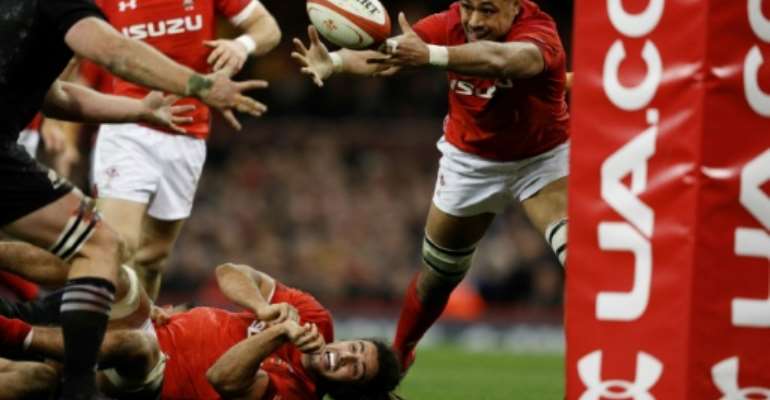 Wales' No. 8 Taulupe Faletau stretches for a loose ball during their rugby union Test match against New Zealand, at the Principality stadium in Cardiff, on November 25, 2017. By Adrian DENNIS (AFP/File)