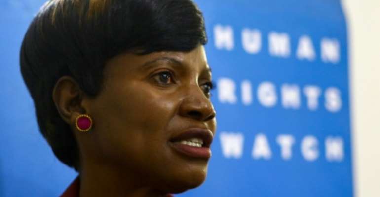 When Malunga's husband died in 2013, his relatives locked her in her home, forced her to open her cash box, and stole $4,000 and the title documents to her property. By Jekesai Njikizana (AFP)