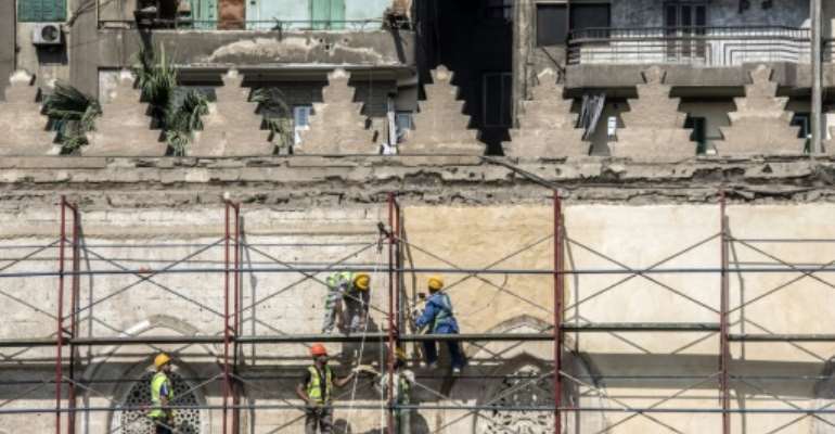 Work on Cairo's 13th-century al-Zahir Baybars mosque in the neglected Islamic quarter resumed last month after being halted during the turmoil that followed the ouster of the dictator Hosni Mubarak in 2011. By Khaled DESOUKI (AFP)