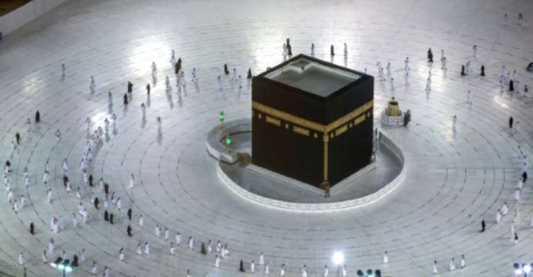 Worshippers circumambulate the Kaaba in the Grand Mosque complex in the Saudi city of Mecca, on October 4, 2020, as authorities partially resume the year-round umrah for a limited number of pilgrims amid the coronavirus pandemic. By - (AFP)