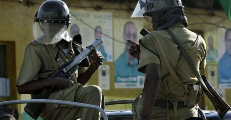 Tanzianian police patrol the streets of Mwembe Makumbi after violent protests across Zanzibar in 2005. By Marco Longari (AFP/File)