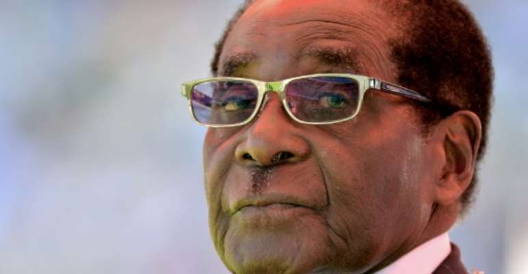 Zimbabwean President Robert Mugabe was toppled three years ago on Saturday, but many in the country feel little has changed. By ALEXANDER JOE (AFP/File)