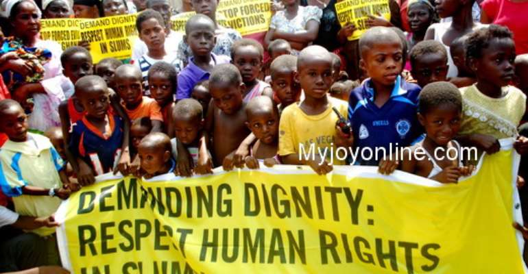A section of the dwellers and their children at the press conference.