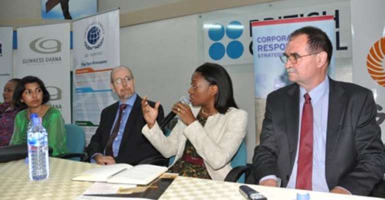 Preba Greenstreet, answering questions at the event. On the right is Professor Wayne Dunn and other dignitaries.