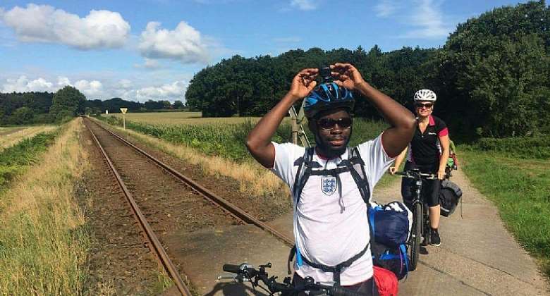 Ghanaian Cycles 19 Days from Denmark to Swansea to fight against Illegal Migration