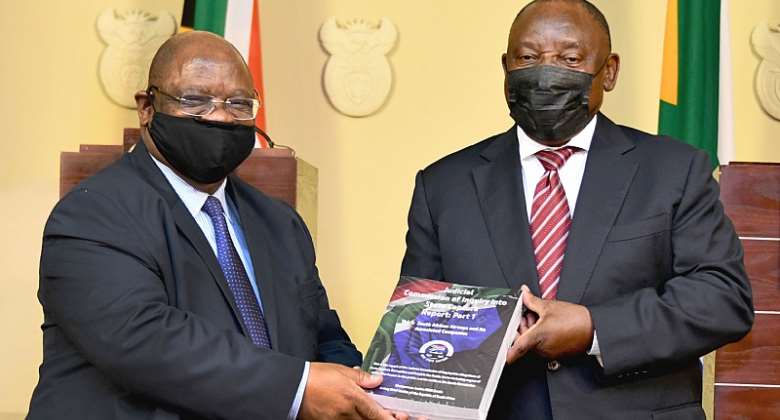 Justice Raymond Zondo, right, hands over part 1 of the State Capture Commission report to President Cyril Ramaphosa on 4 January.  - Source: GCISFlickr