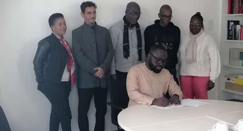 Comrade Otukunor signing the declaration on behalf of the NDC