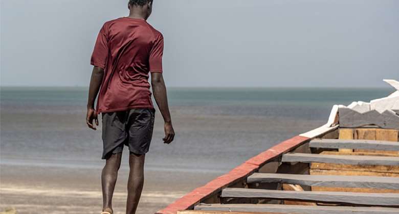 Sheikul narrates his migration experience while on an empty boat, similar to the one he traveled on. Photo: IOM2021