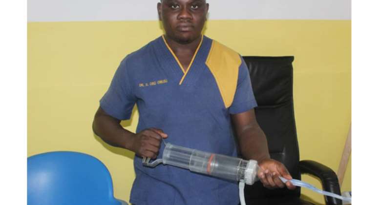 Dr Gerald Osei-Owusu with the hemafuse medical device